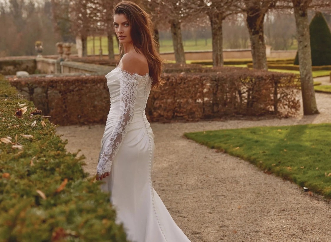 Model wearing a white gown