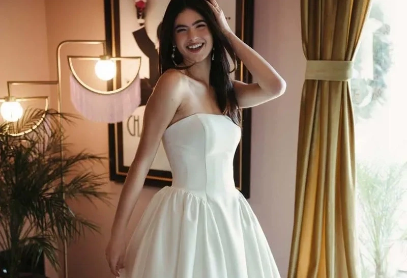 Model wearing a gown by Stella York