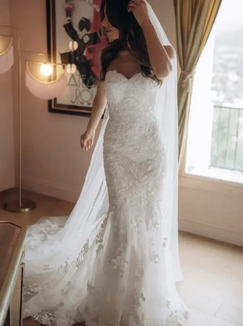 Model wearing a gown by Stella York