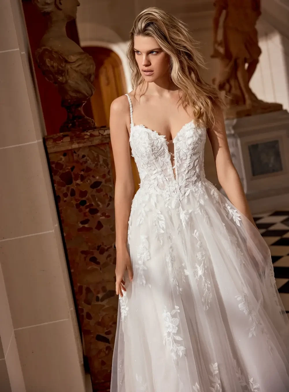 Model wearing a gown by Justin Alexander