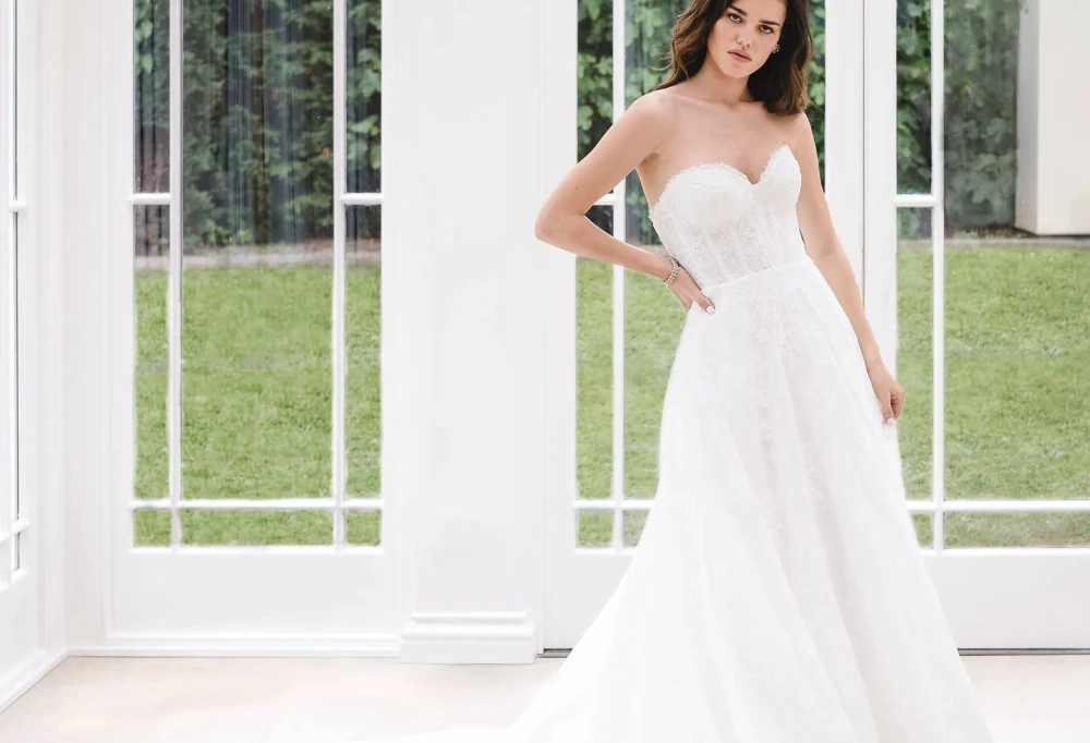 Model wearing a gown by Castigliano Collection