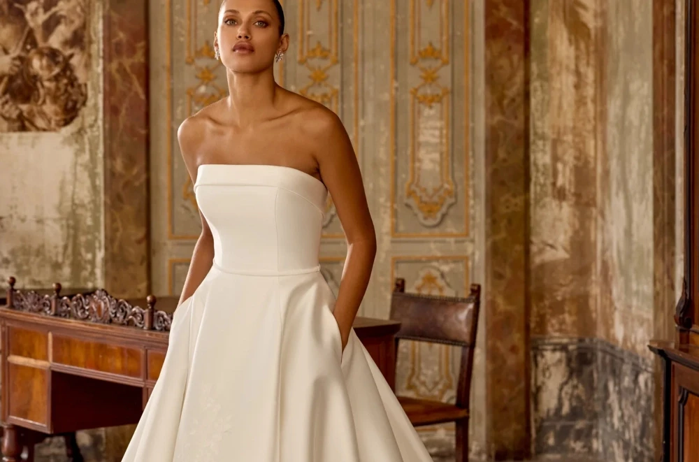 Model wearing a gown by Justin Alexander
