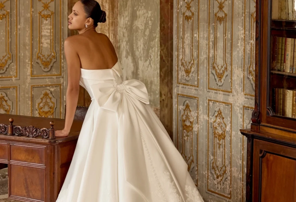 Model wearing a gown by Justin Alexander