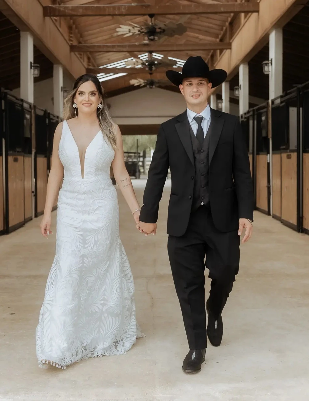 Сouple wearing a white gown and a black suit