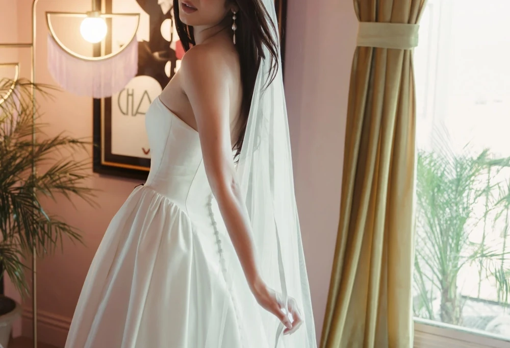 Model wearing a gown by Stella York