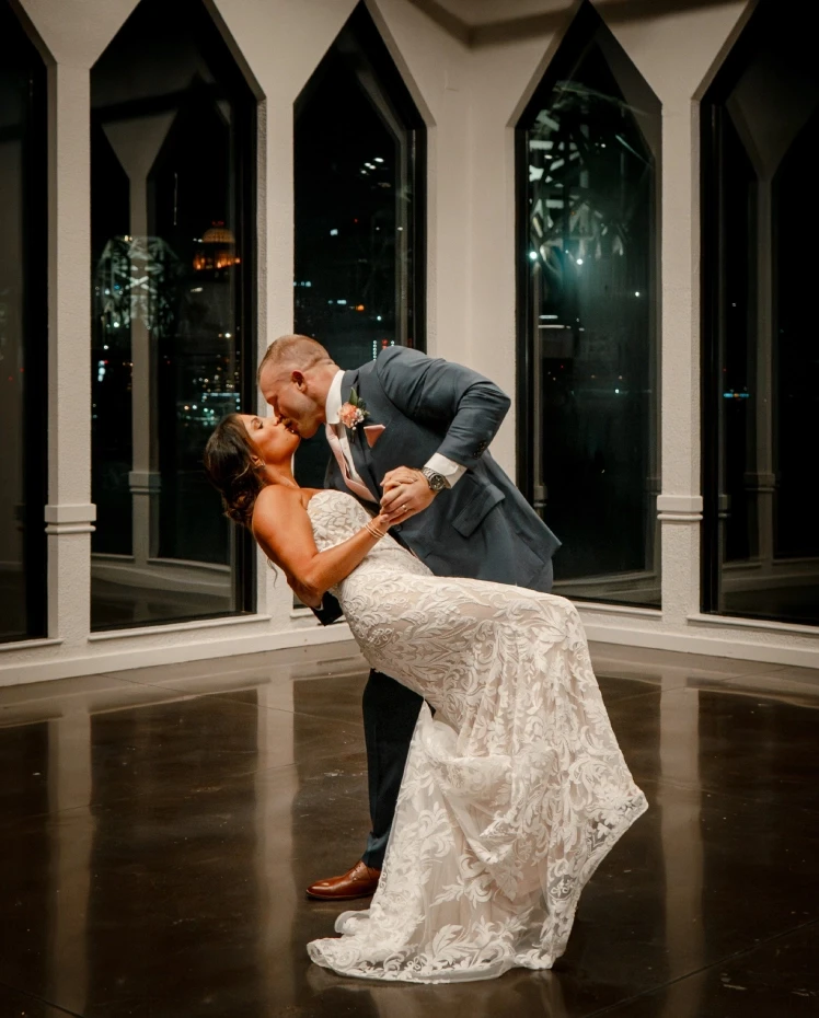 Сouple wearing a white gown and a white suit