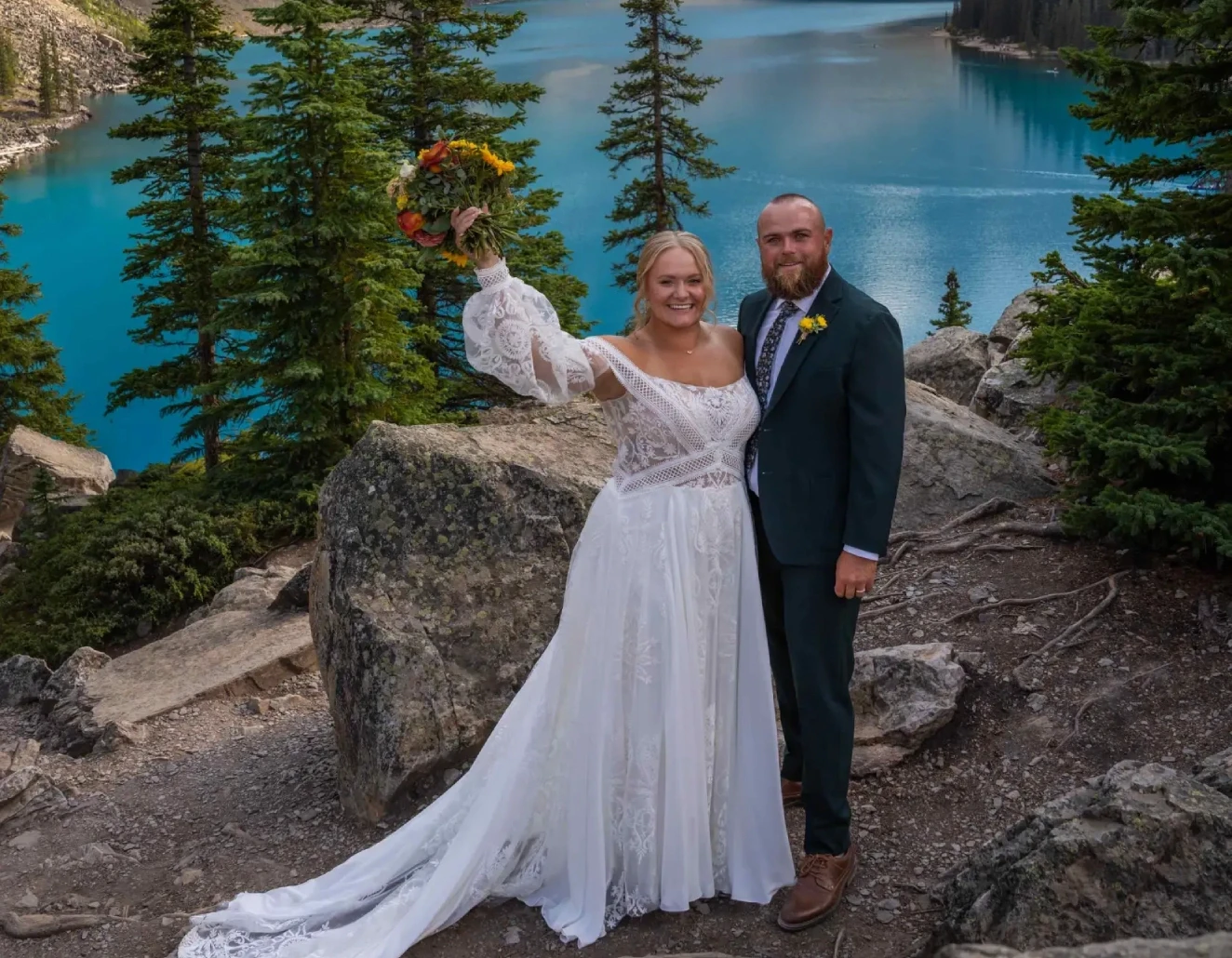 Сouple wearing a white gown and a gray suit