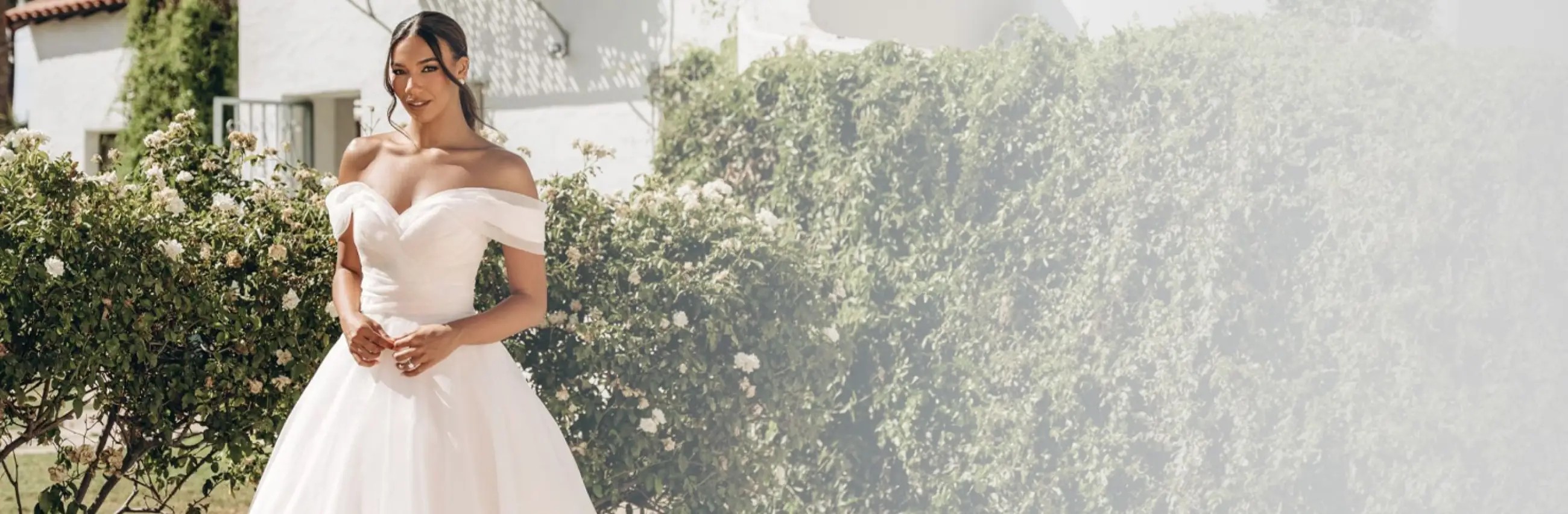 Model wearing a white gown