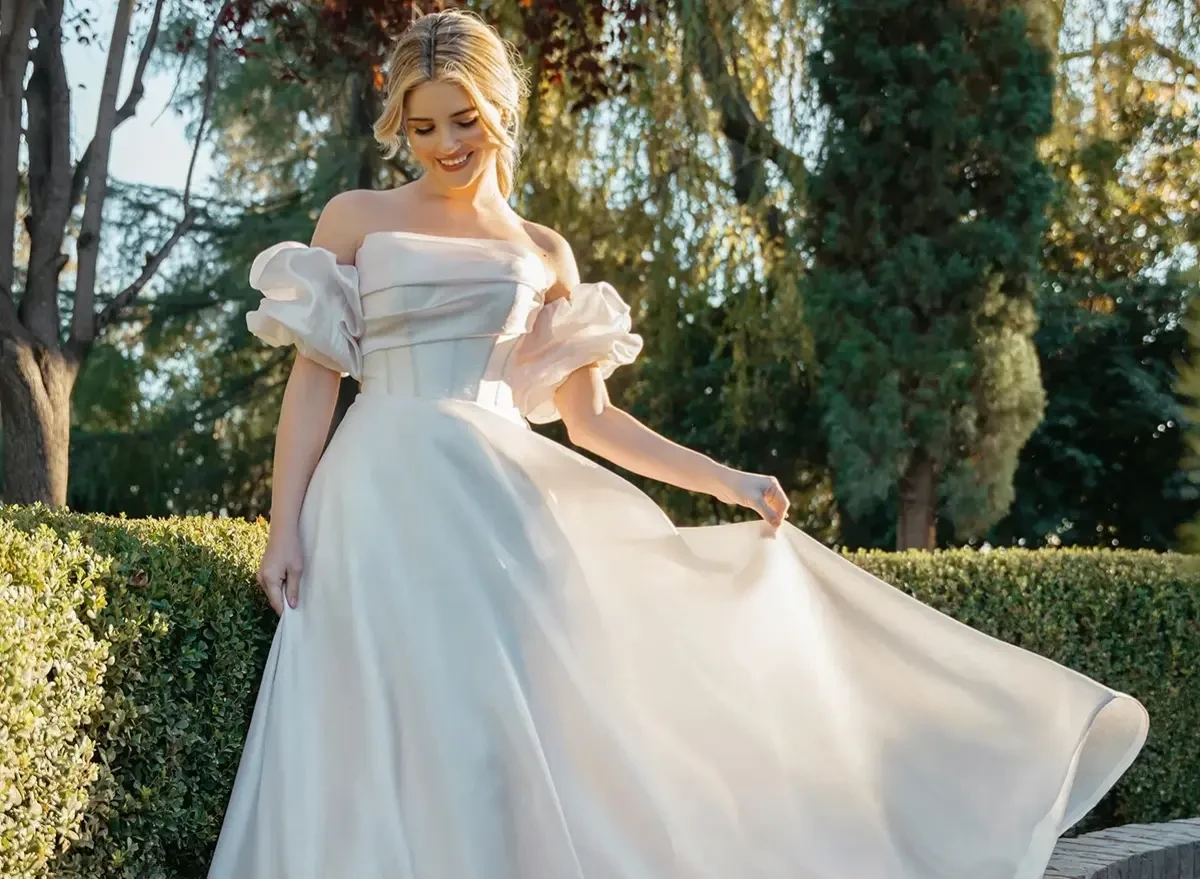Model wearing a white gown