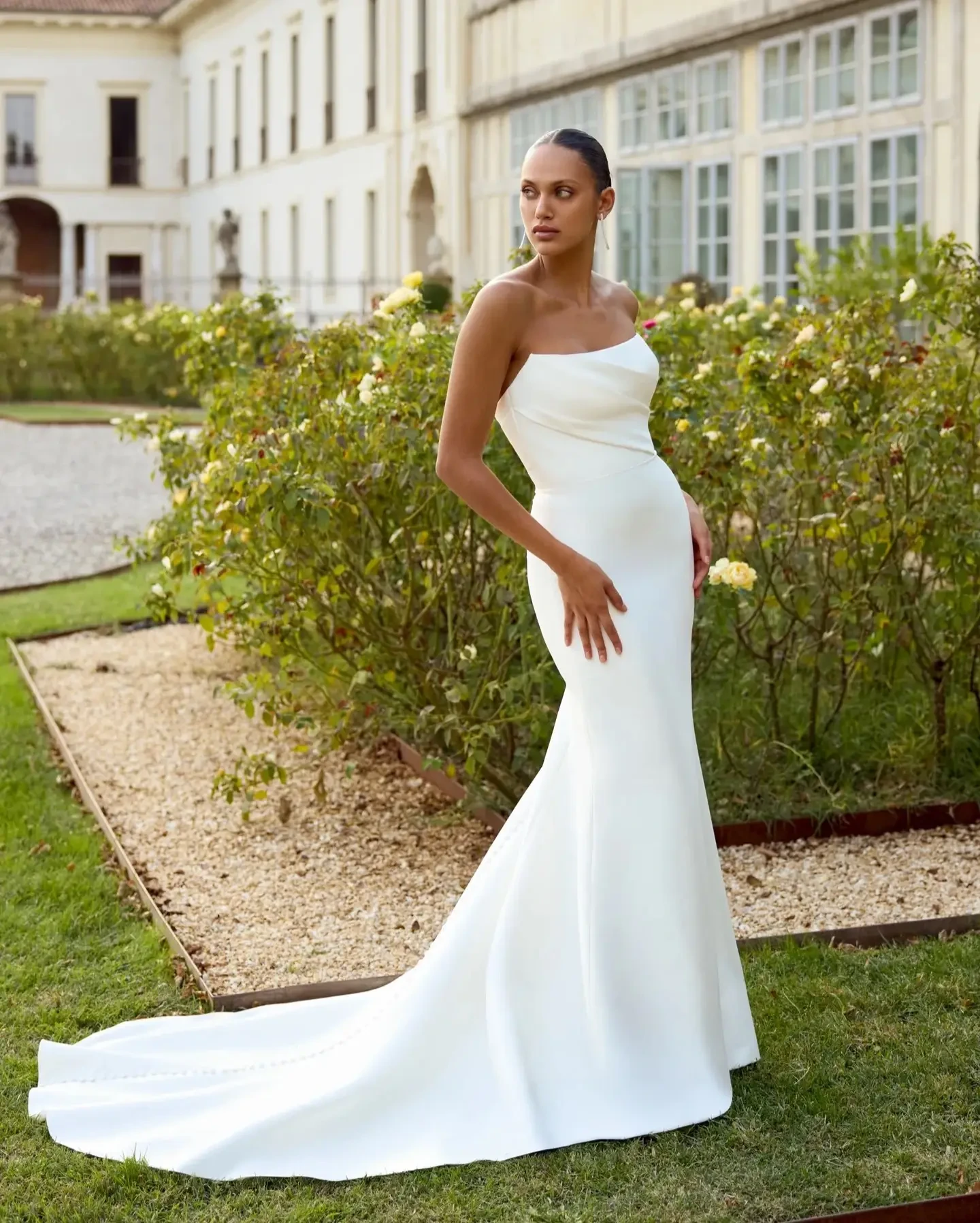 Model wearing a white gown