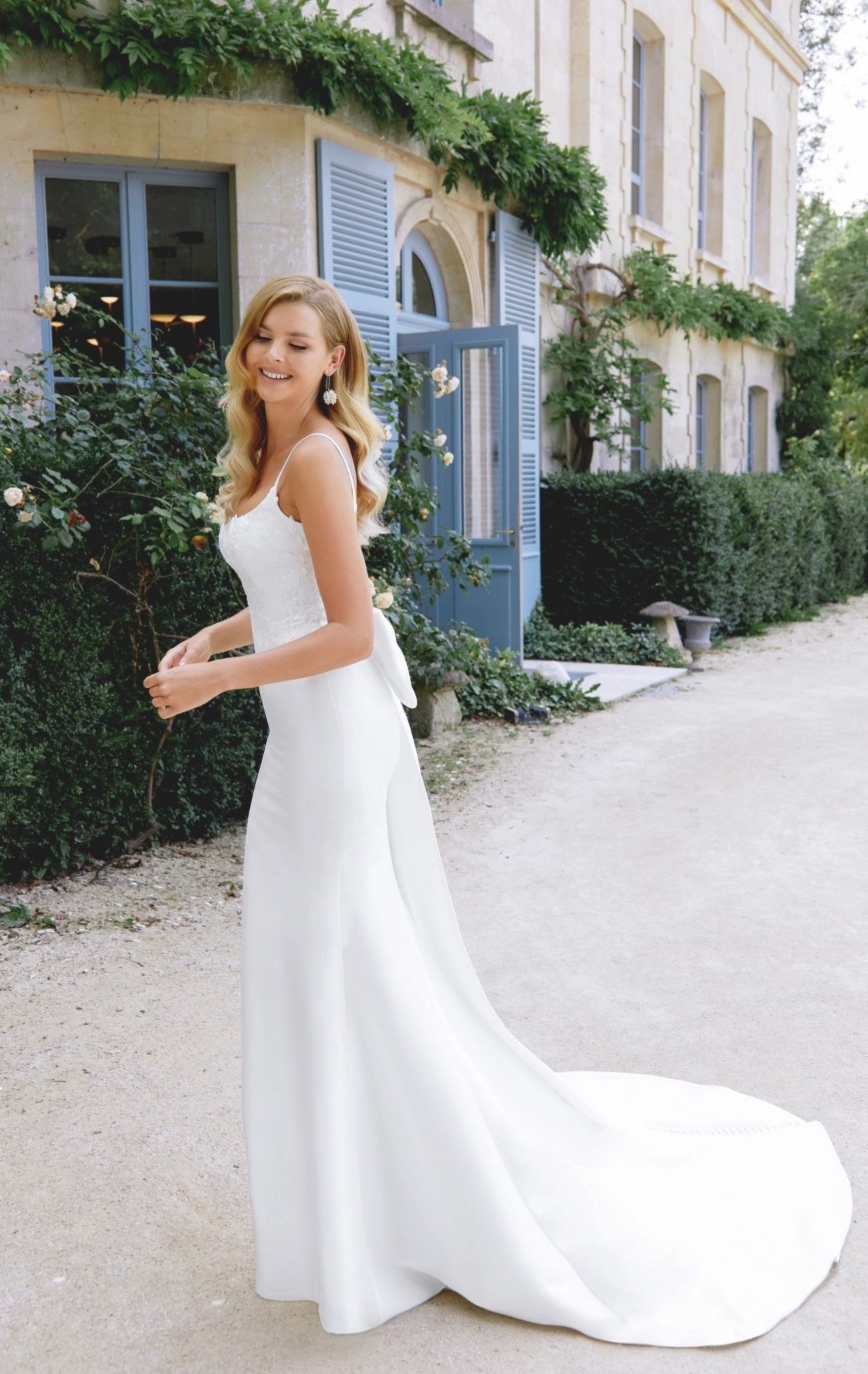 Model wearing a white gown