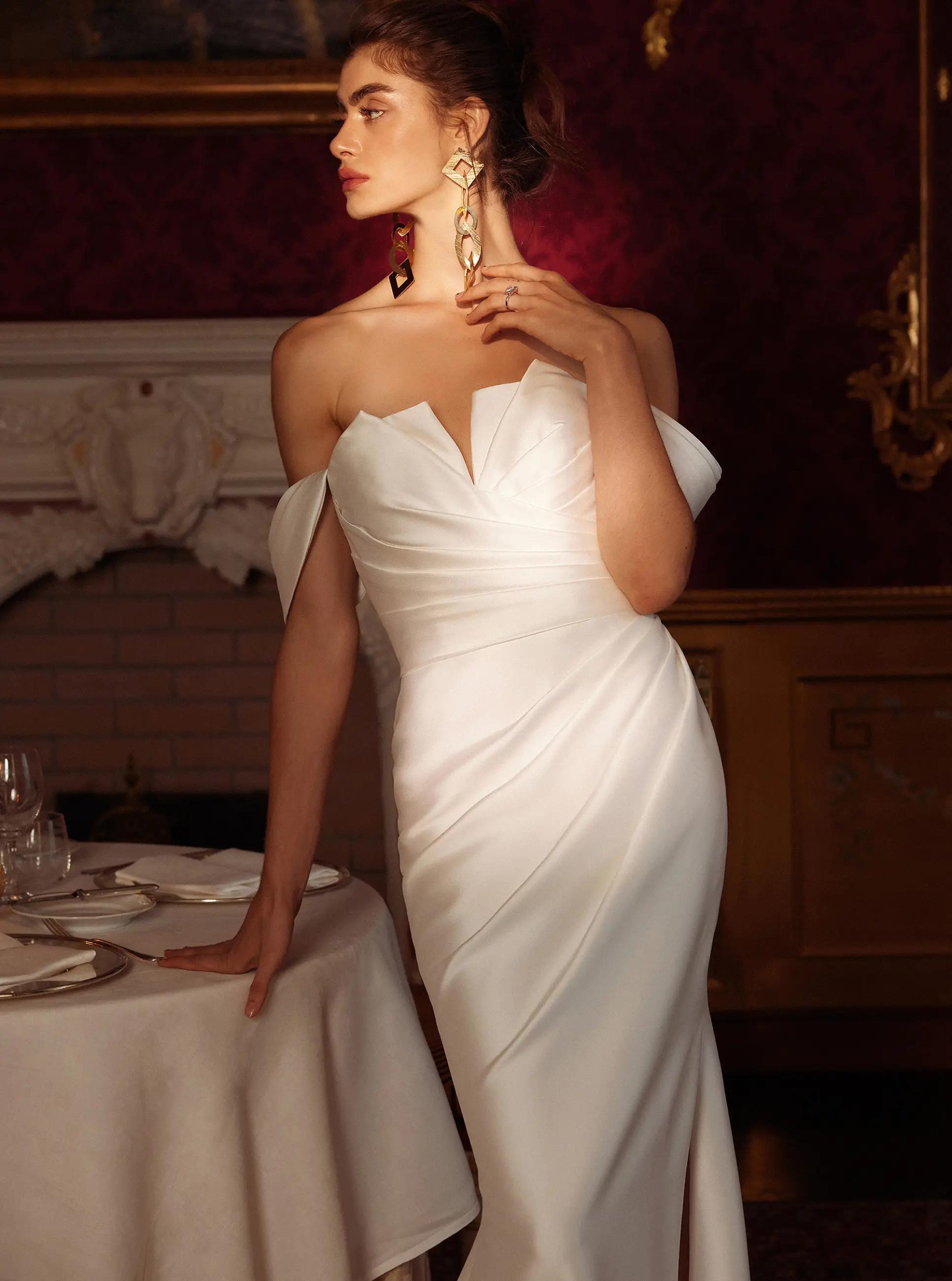 Model wearing a gown by Stella York