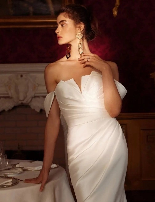 Model wearing a gown by Justin Alexander