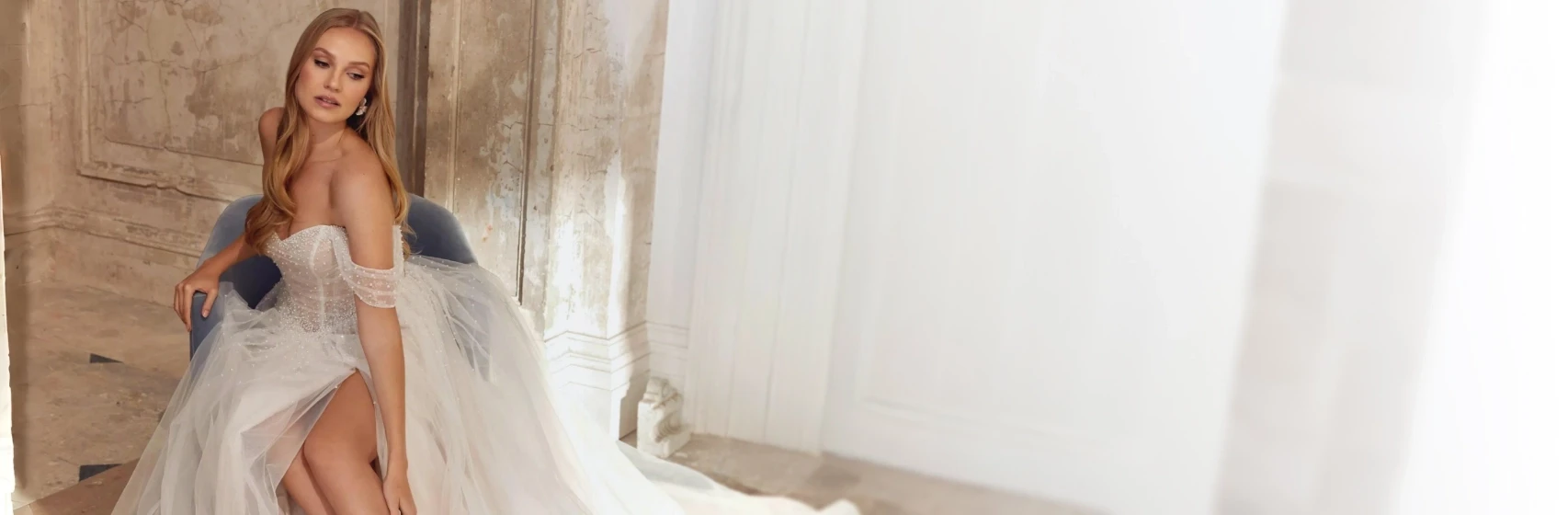 Model wearing a white gown